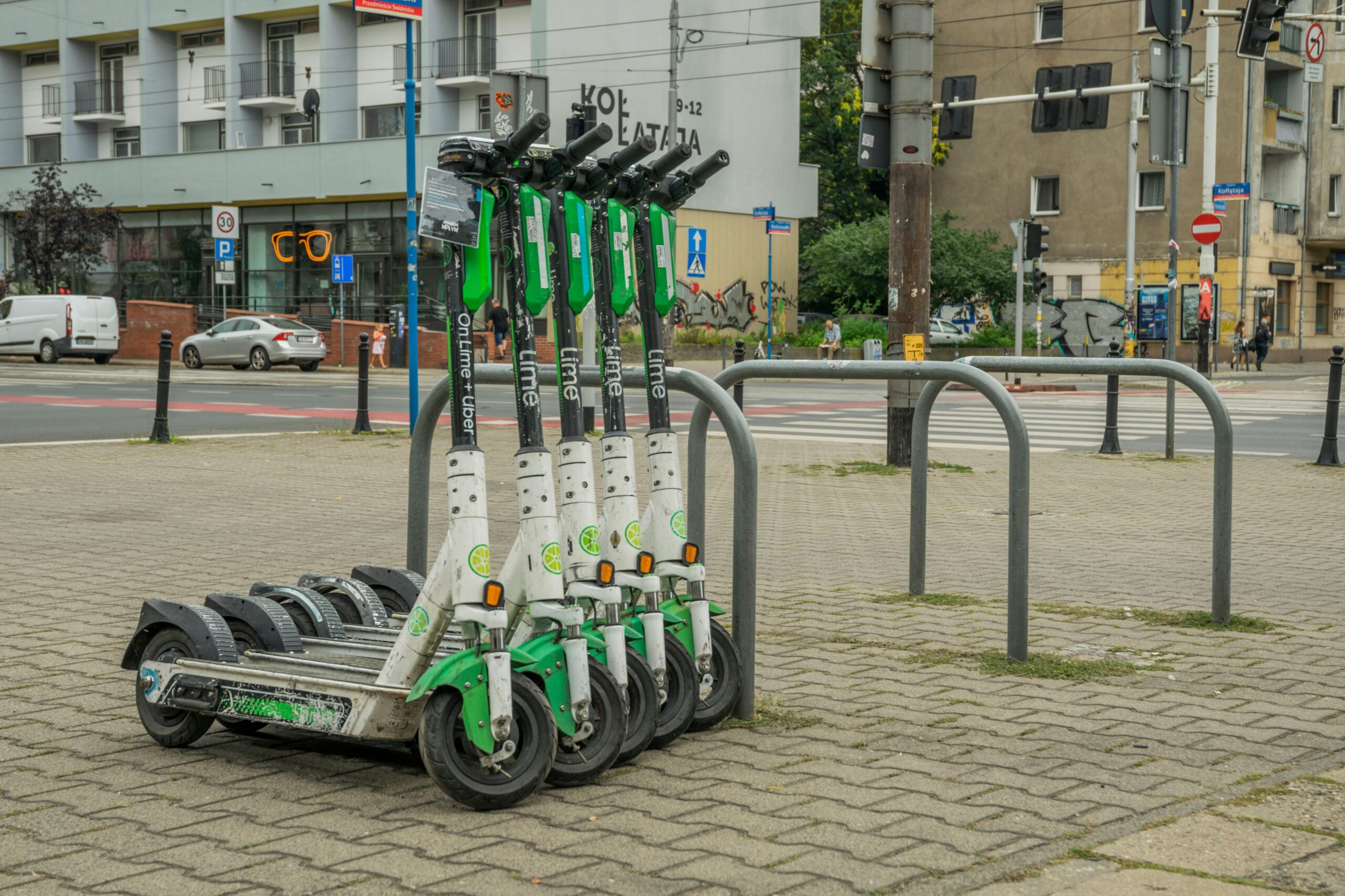 lime scooters parked on the sidewalk